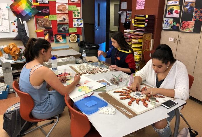 Students working on their mosaics